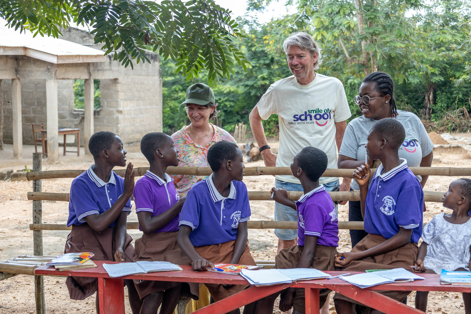children learning under trees- courtesy smileatschool